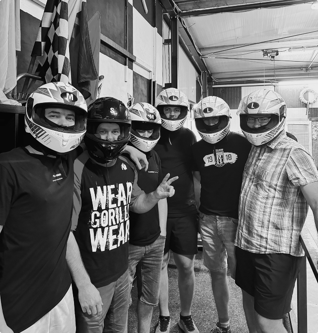 Team members ready for go-kart racing during teambuilding, 2024